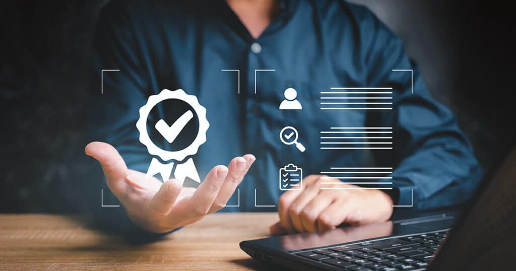 Man working at computer with authority seal